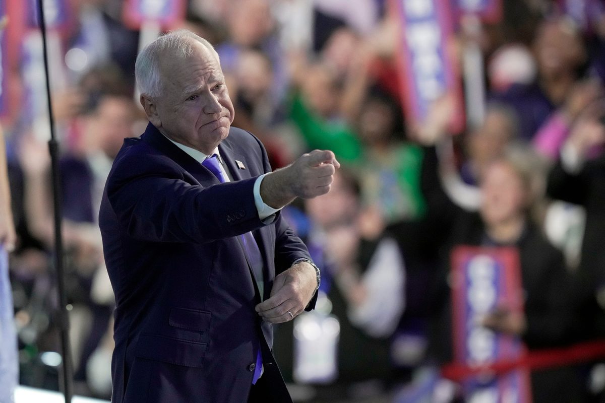 Aug 21, 2024; Chicago, IL, USA; Democratic Vice Presidential nominee Tim Walz acknowledges people in the crowd after delivering his acceptance speech during the third day of the Democratic National Convention at the United Center. Mandatory Credit: Mark Hoffman-USA TODAY