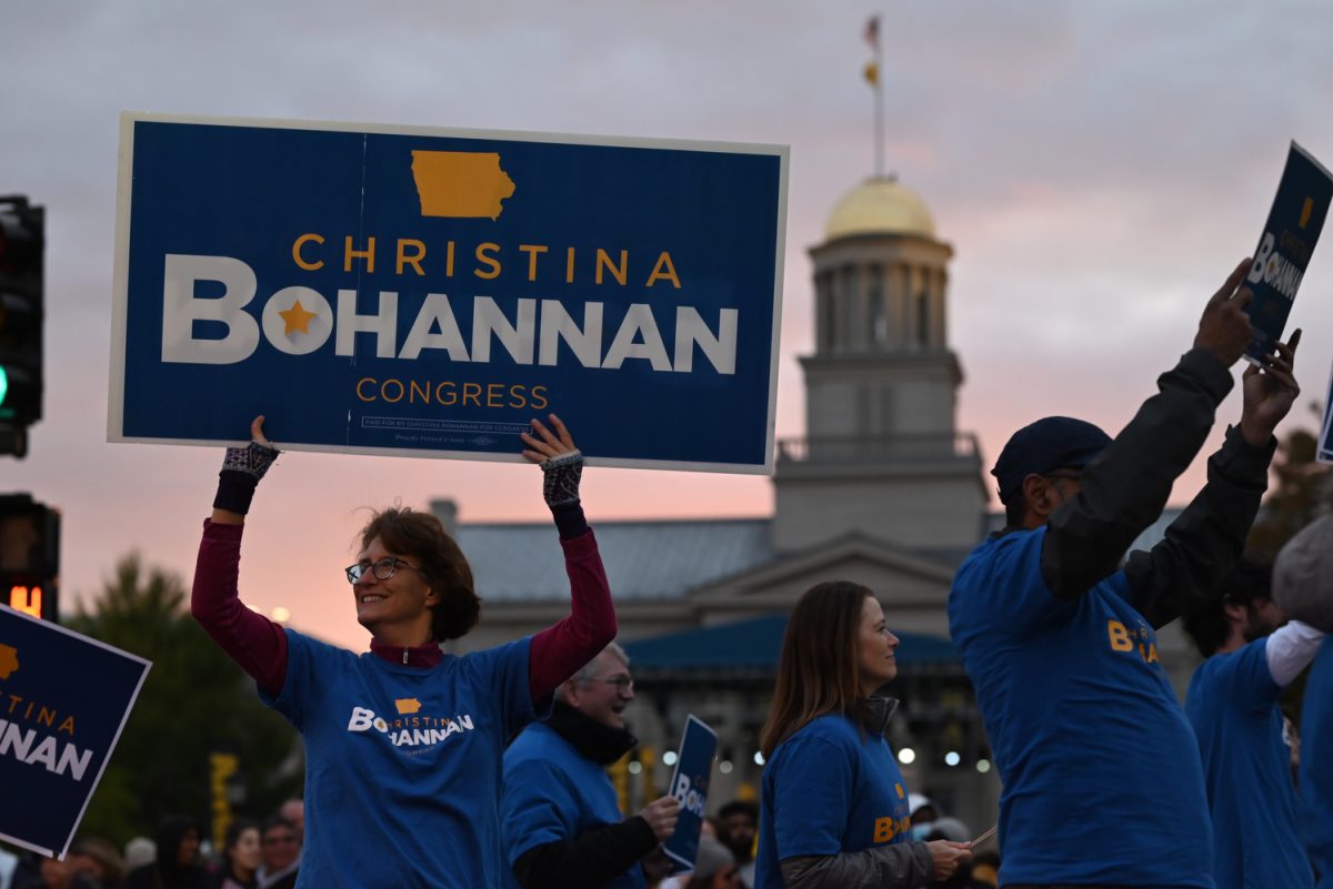 Christina Bohannan campaign members walk during the University of Iowa Homecoming Parade on North Clinton Street in downtown Iowa City on Friday, Oct. 6, 2023. A recent pull shows Bohannan leading in Iowa's 1st Congressional District.