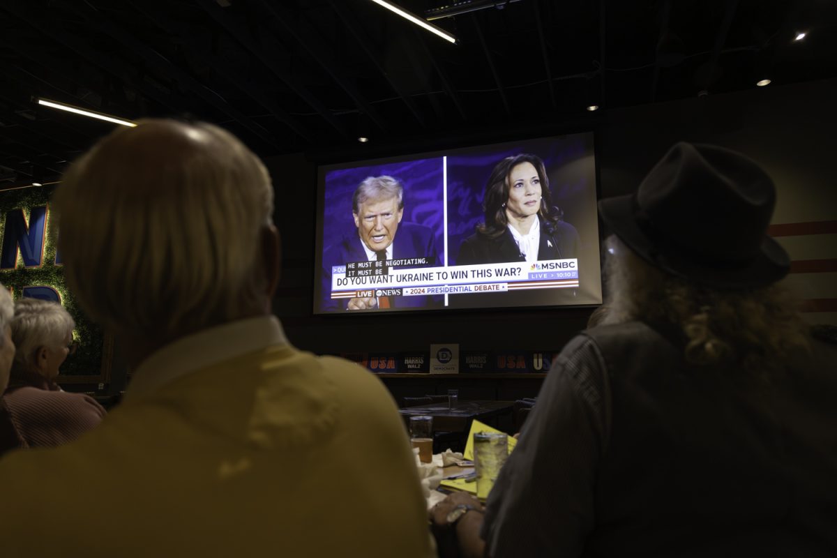 Attendees watch the 2024 Presidential debate during a watch party at Big Grove Brewery in Iowa City on Tuesday, Sept. 10, 2024. The watch party was hosted by the Johnson County Democrats.