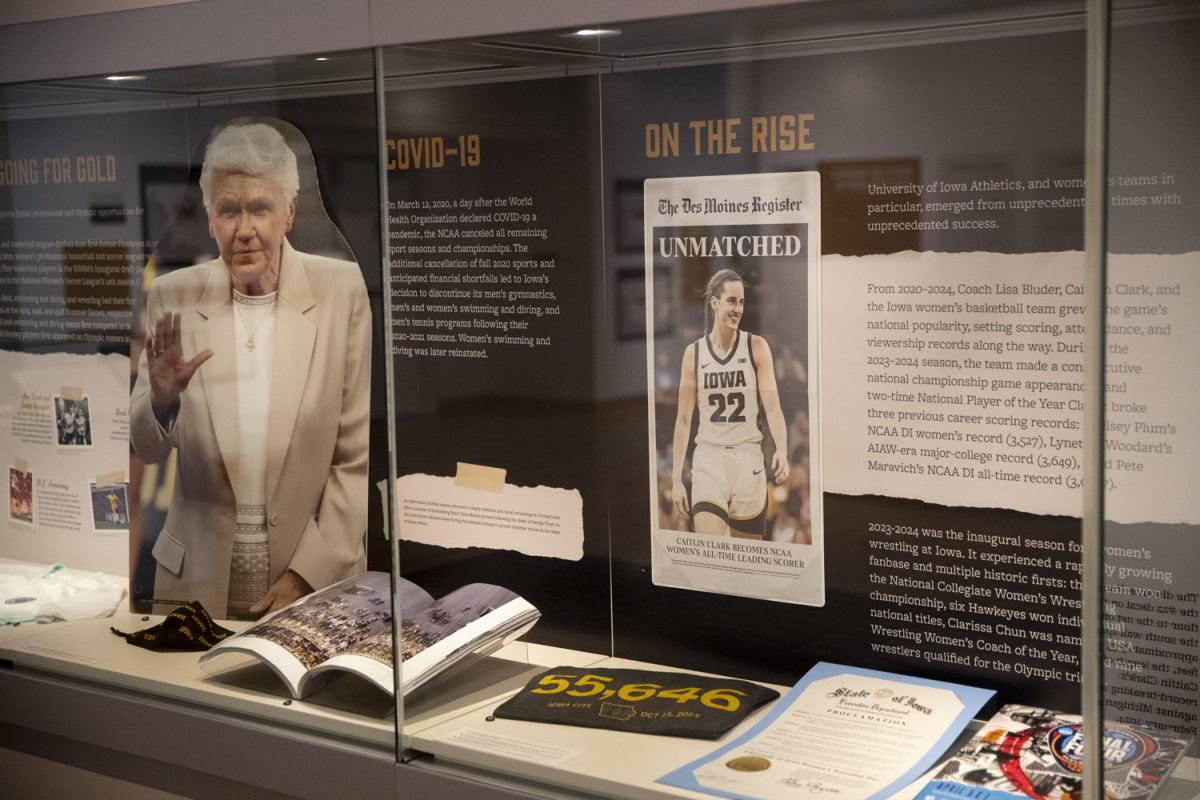 The Hawkeye Histories gallery is seen in the University of Iowa main library on Monday, Aug. 26, 2024. The gallery showcases items from important moments in Iowa athletics history.