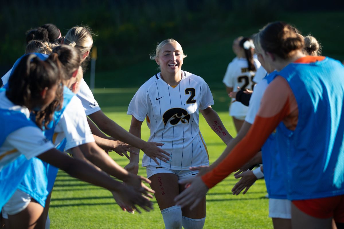 Iowa freshman forward Berit Parten runs through a tunnel of Hawkeye players before a soccer match between Iowa and Wake Forest at the University of Iowa Soccer Complex on Sunday, Sept. 1, 2024. The Hawkeyes defeated the Deacon Demons 2-0.