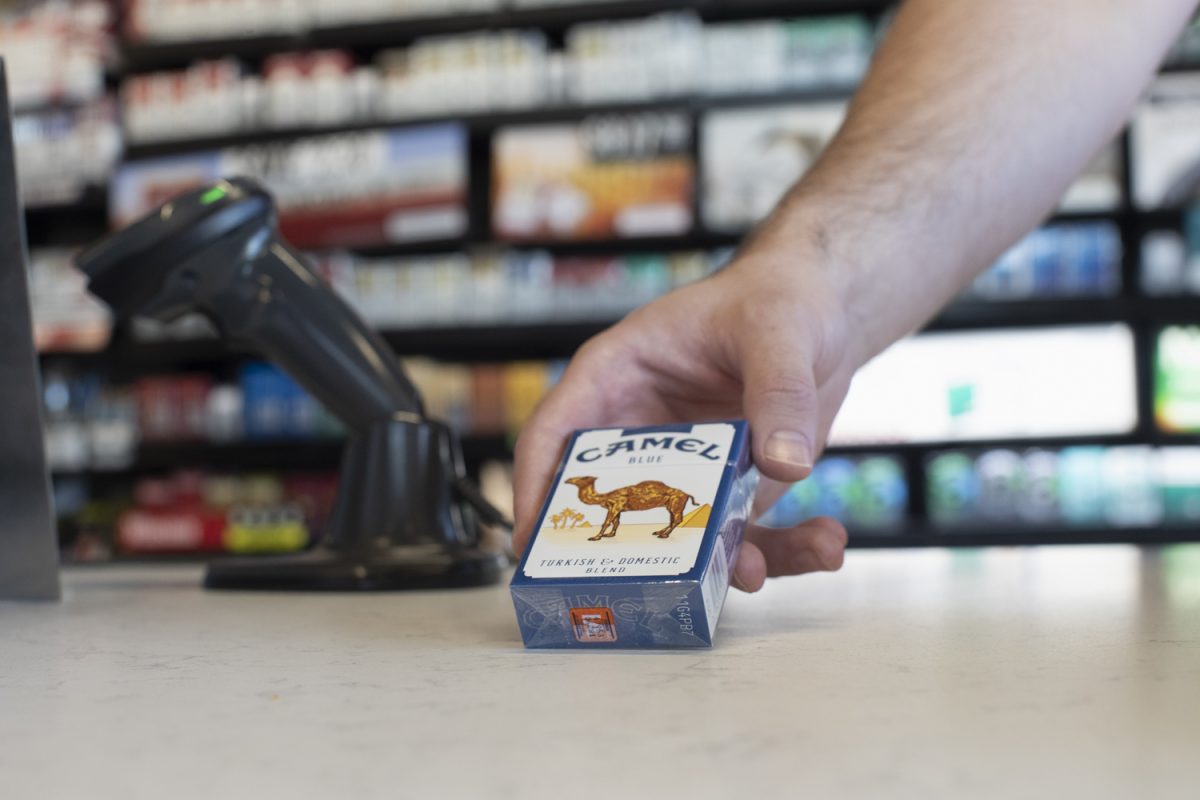 Cigarettes are seen being placed on the counter at Kum & Go on Monday, Sept. 2, 2024. Iowa City has a tobacco moratorium in place until January 2025, and discussions regarding further restrictions for tobacco retailers is underway.