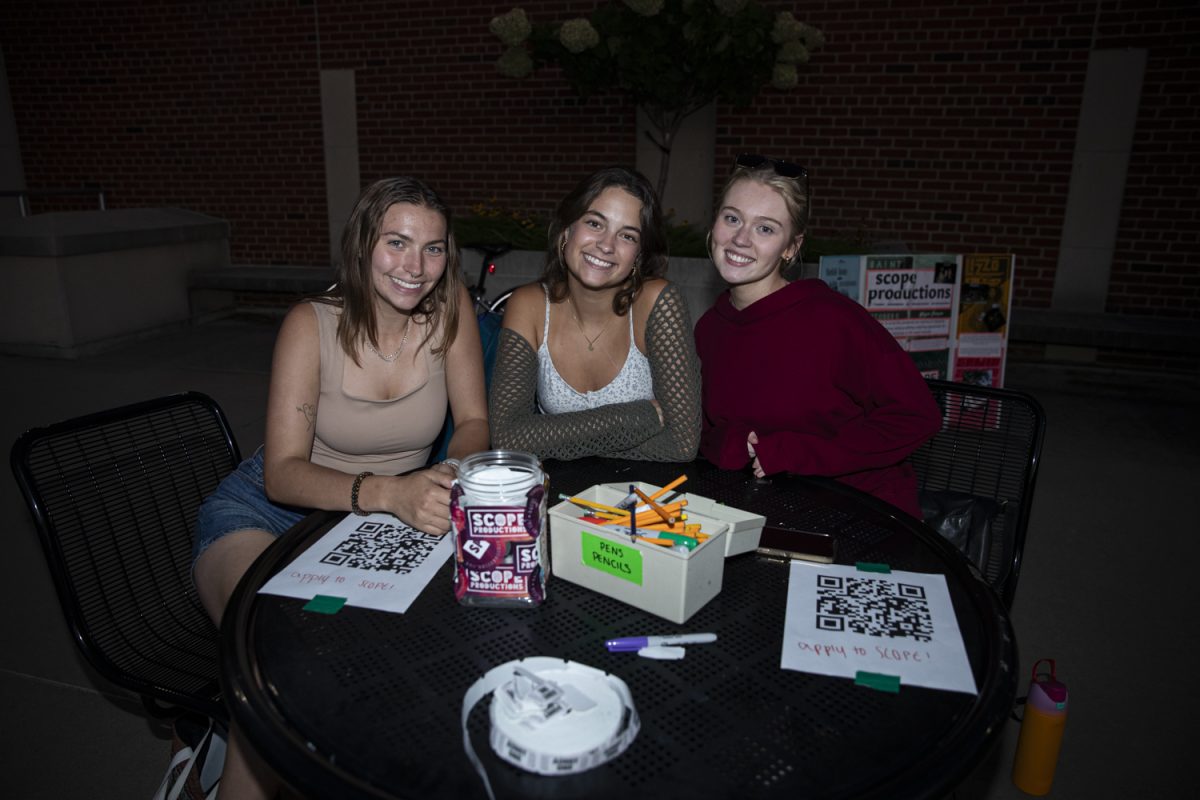 University of Iowa SCOPE members pose for a photo during a battle of the bands, hosted by University of Iowa SCOPE productions, at Iowa Memorial Union's River Amphitheater on Wednesday, Sept. 4, 2024. (Jordan Barry/The Daily Iowan)