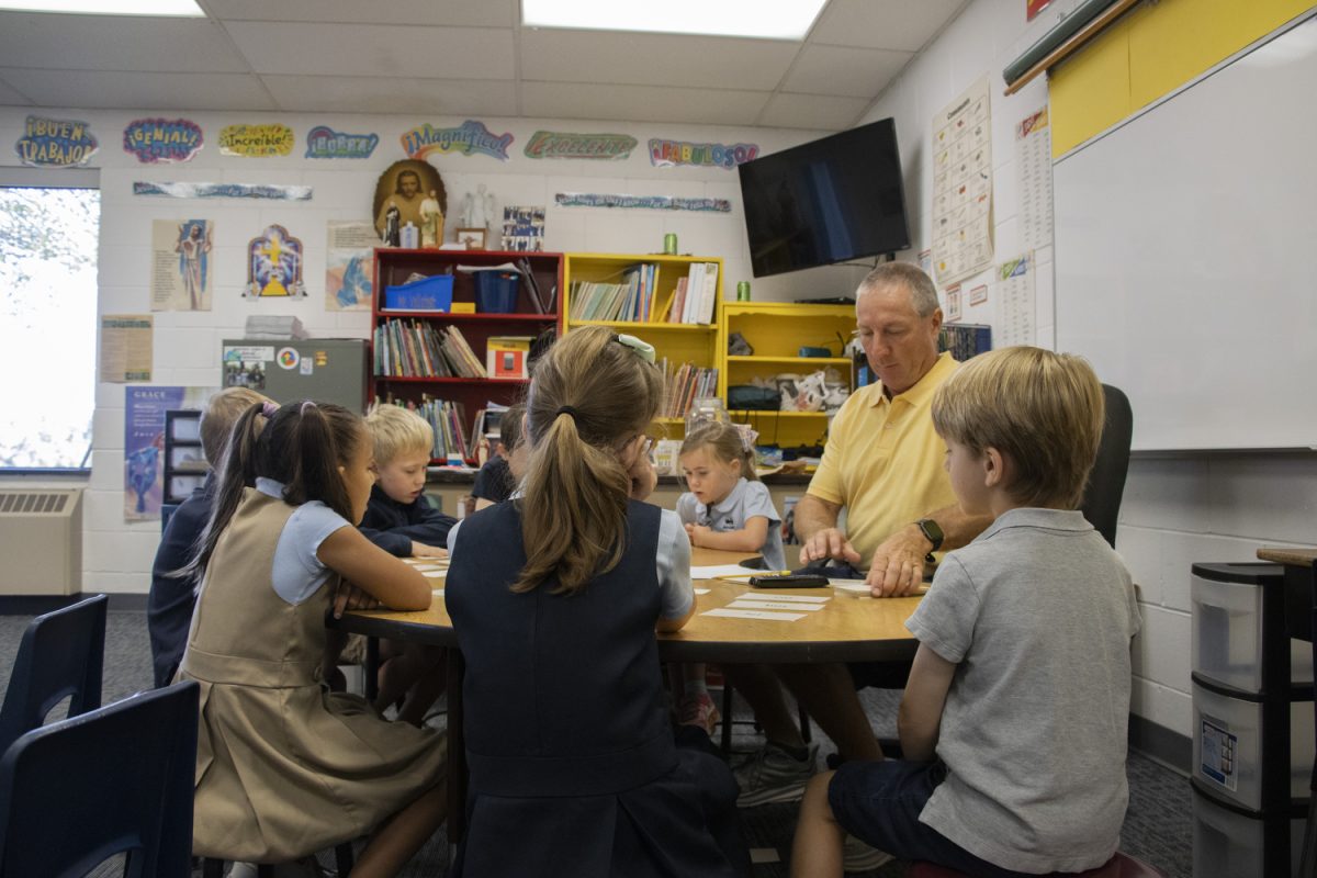 A Regina Catholic Education Center class meets in a small group with their teacher on Sept. 3. Education Savings Accounts, or ESAs, have led to an increase in families enrolled in private schools.