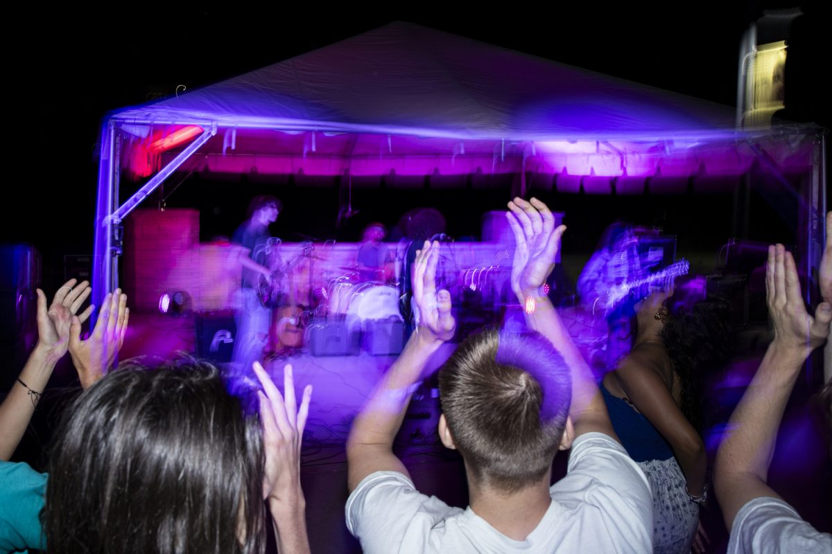 Attendees cheer during a battle of the bands, hosted by University of Iowa SCOPE productions, at Iowa Memorial Union’s River Amphitheater on Wednesday, Sept. 4, 2024. Local bands included; 28 Days Later, The Bits, One More Hour, and Kobe Williams and the Fantasy.