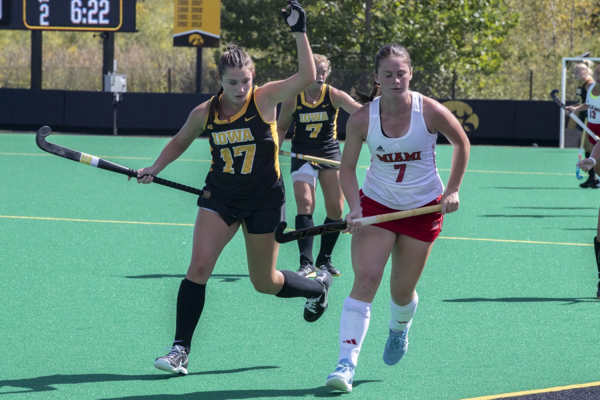 Iowa forward Hannah Maney and Miami midfielder Carlie Servis watch the ball roll out of bounds during a field hockey game between Iowa and Miami University at Grant Field on Friday, Sept. 6, 2024. The Hawkeyes defeated the Redhawks, 2-0.