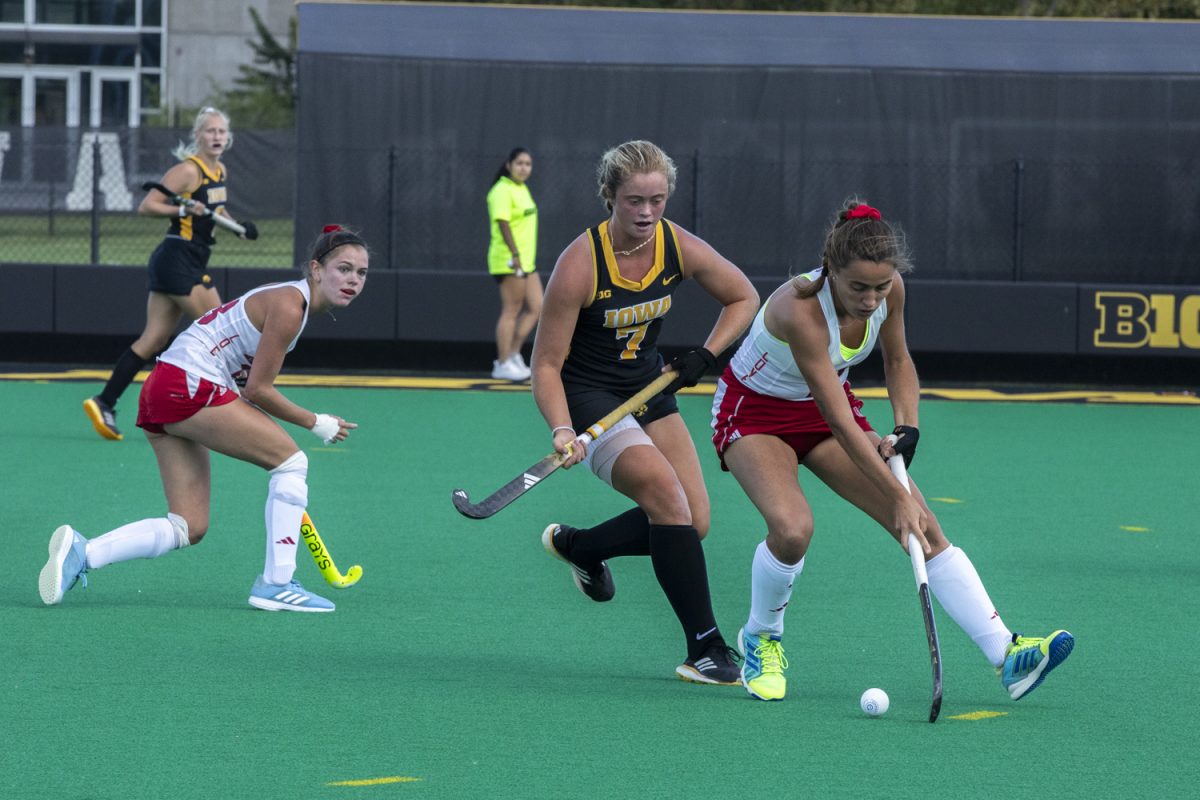 Iowa midfielder Gia Whalen tries to block a Redhawk pass during a field hockey game between Iowa and Miami University at Grant Field on Friday, Sept. 6, 2024. The Hawkeyes defeated the Redhawks, 2-0.