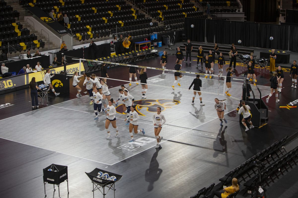 Players warmup before a game between Iowa and Cal Baptist at Xtream Arena in Coralville on Saturday, Sept. 7, 2024. The Hawkeyes defeated the Lancers 3-0.