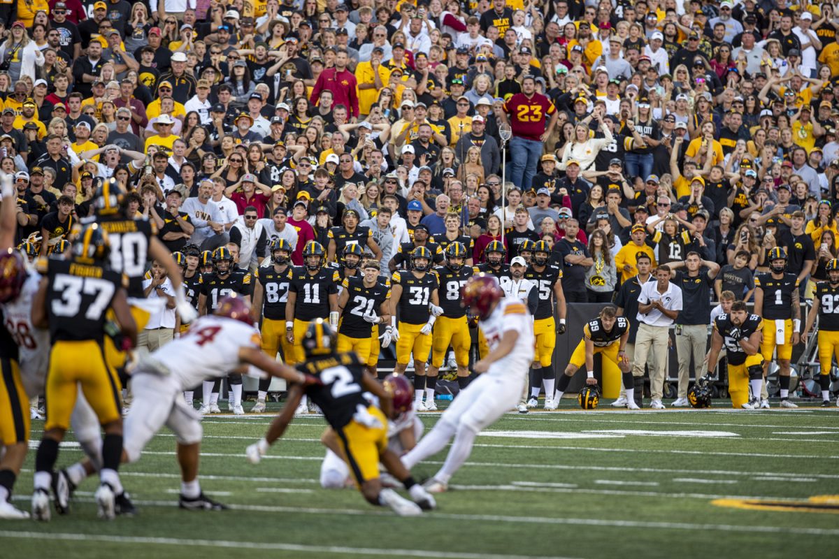 Fans, coaches, and staff watch Iowa State kicker Kyle Konrardy attempt the game-winning field goal during a Cy-Hawk football game between No. 21 Iowa and Iowa State at Kinnick Stadium on Saturday, Sept. 7, 2024. The Cyclones defeated the Hawkeyes, 20-19. Konrardy sealed the game winning 54-yard field goal with six seconds left.