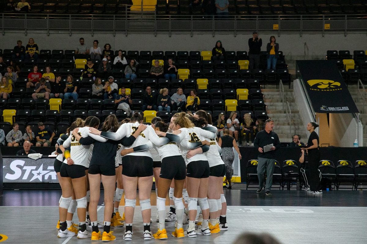 Iowa players huddle before a game between Iowa and Cal Baptist at Xtream Arena in Coralville on
Sept. 7. The Hawkeyes defeated the Lancers 3-0.