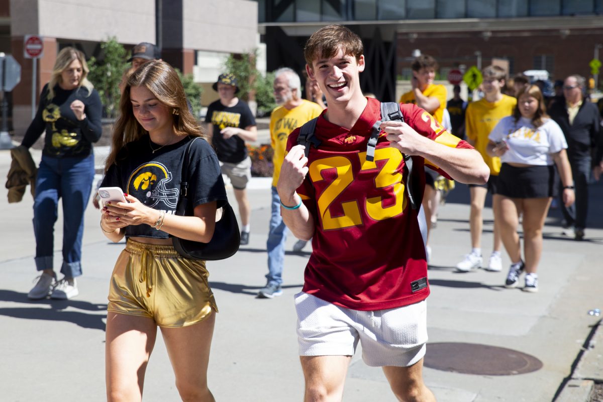 An Iowa State fan poses for a picture before a game between Iowa and Iowa State in Iowa City on Saturday, Sept. 7, 2024.