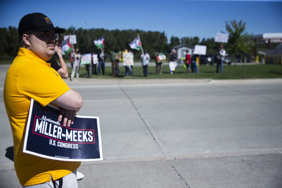 Volunteers and staff of the Miller-Meeks campaign direct traffic before the fourth annual “Triple M” Tailgate featuring Iowa Rep. Mariannette Miller-Meeks at Streb Construction in Iowa City on Saturday, Sept. 7, 2024. A small contingent of pro-Palestine protestors demonstrated outside while three activists disrupted the event from inside. Rep. Miller-Meeks will be running against former University of Iowa Law professor Christina Bohannon for Iowa’s first congressional district. 