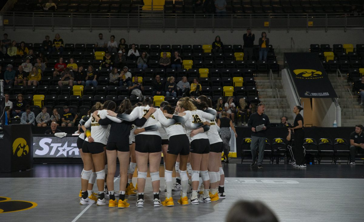 Iowa players huddle before a game between Iowa and Cal Baptist at Xtream Arena in Coralville on Saturday, Sept. 7, 2024. The Hawkeyes defeated the Lancers 3-0. 