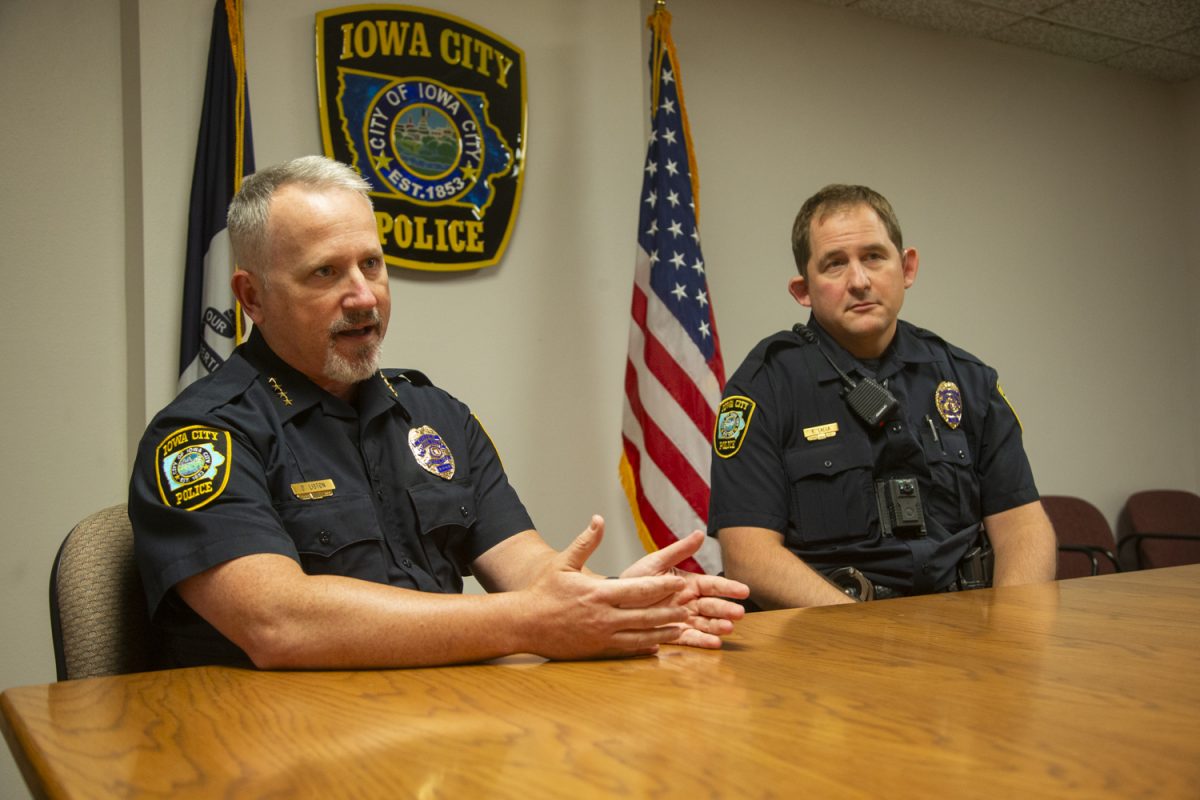 Chief of Iowa City Police Dustin Liston (left) and newly hired officer Gregory Lalla (right) speak about the recent hiring of new officers inside the Iowa City Police Department building on Monday, Sept. 9, 2024. Officer Lalla was a former Sergeant of the Davenport Police Department before returning to his hometown of Iowa City to work as an officer.