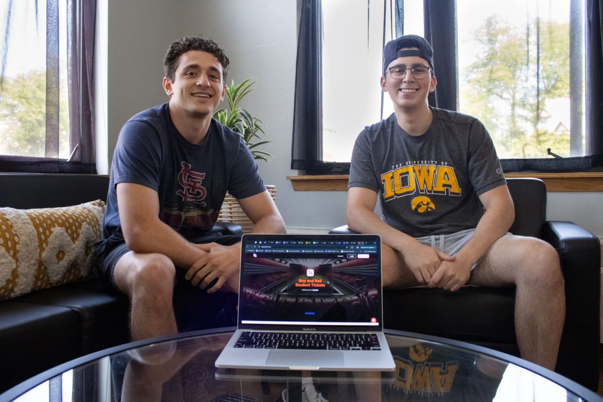 SeatStock CFO Adam Hassan (left) and CEO Josh Cohen (right) pose beside their website SeatStock at the Bedell Entrepreneurship Learning Laboratory in Iowa City on Sept. 12, 2024. SeatStock is a website designed to let students get sports tickets without the risk of being scammed.