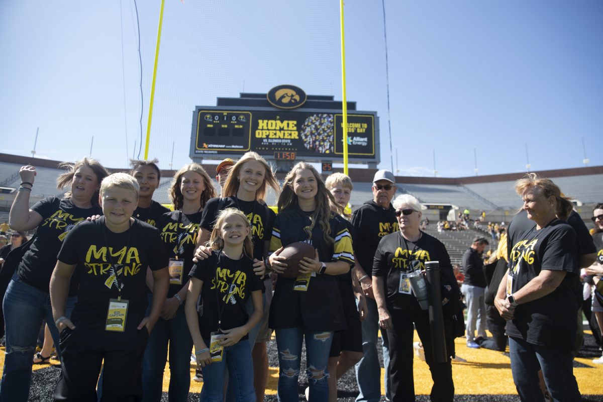 Mya Gilchrist poses for a portrait with her family on Aug. 10, 2024.