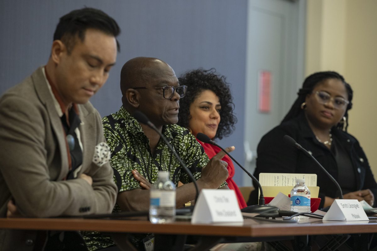 Smith Likongwe addresses the audience during an International Writer Program panel held in the Iowa City Public Library on Sept. 13. The panel focused on storytelling in the digital age.