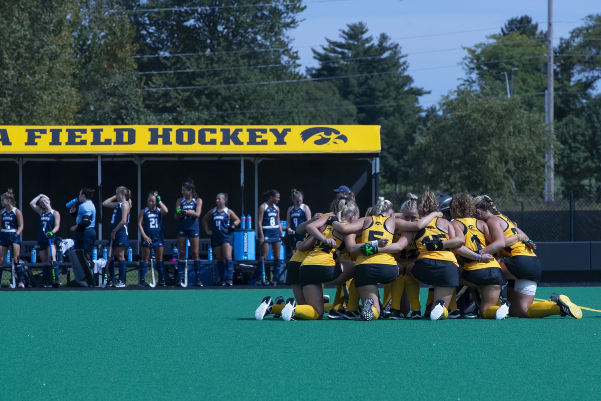 Iowa players huddle before a field hockey game between Iowa and New Hampshire at Grant Field in Iowa City on Sept. 13, 2024. The Hawkeyes defeated the Wildcats 5-0.