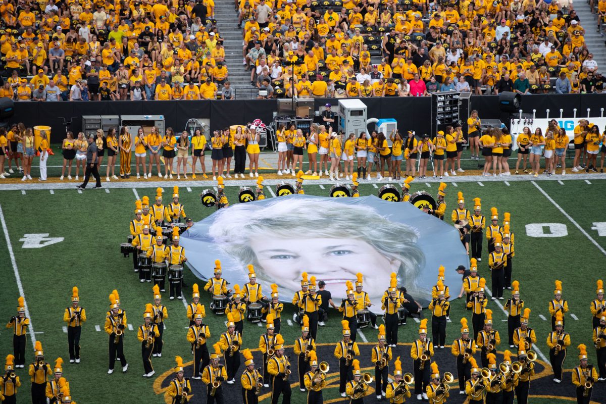 Iowa Marching Band holds up a banner of Lisa Bluder during halftime at a football game between Iowa and Troy at Kinnick Stadium on Saturday, Sept. 14, 2024. The Hawkeyes defeated the Trojans, 38-21. 