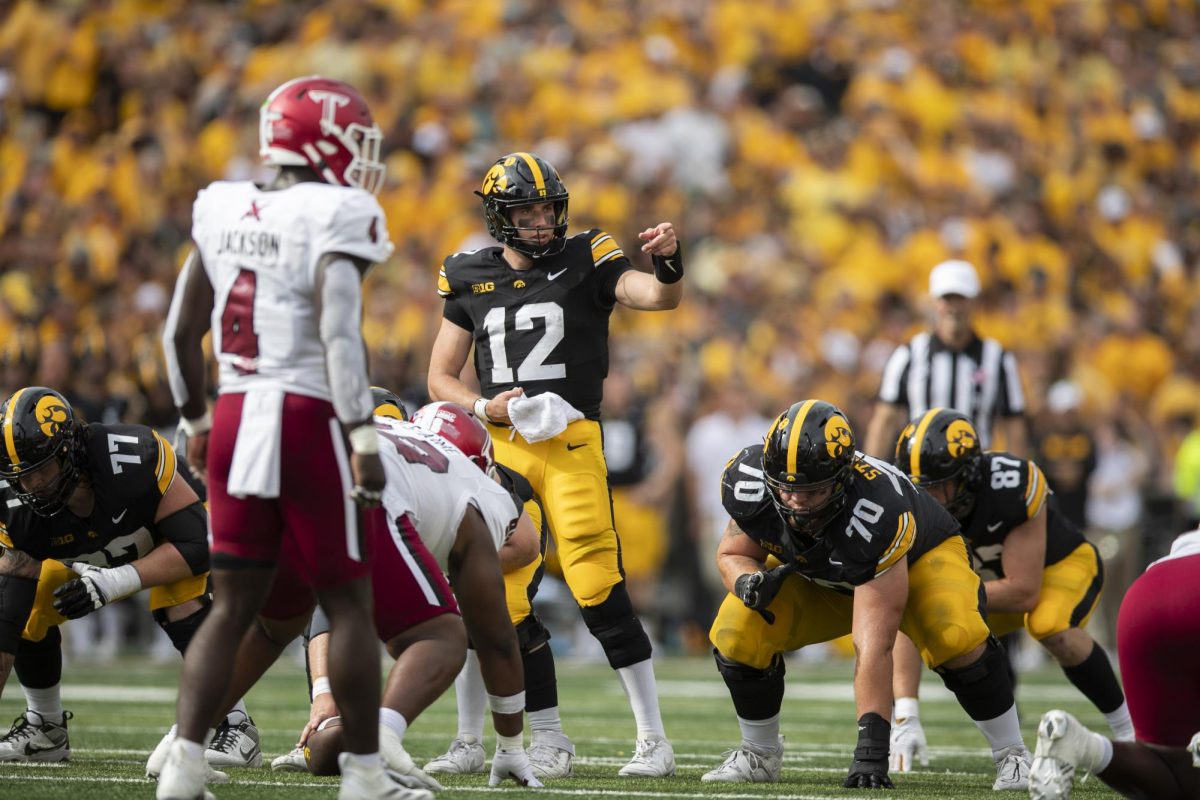 Iowa quarterback Cade McNamara prepares to take a snap during a football game between Iowa and Troy on Sept. 14 at Kinnick Stadium. The Hawkeyes defeated the Trojans, 38-21. 