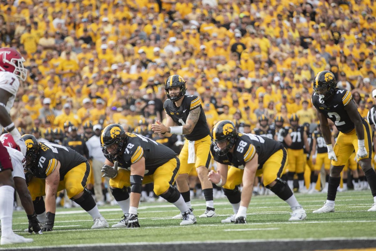 Iowa quarterback Brendan Sullivan lines up to take a snap during a football game between Iowa and Troy on Sept. 14 at Kinnick Stadium. The Hawkeyes topped the Trojans, 38-21. 