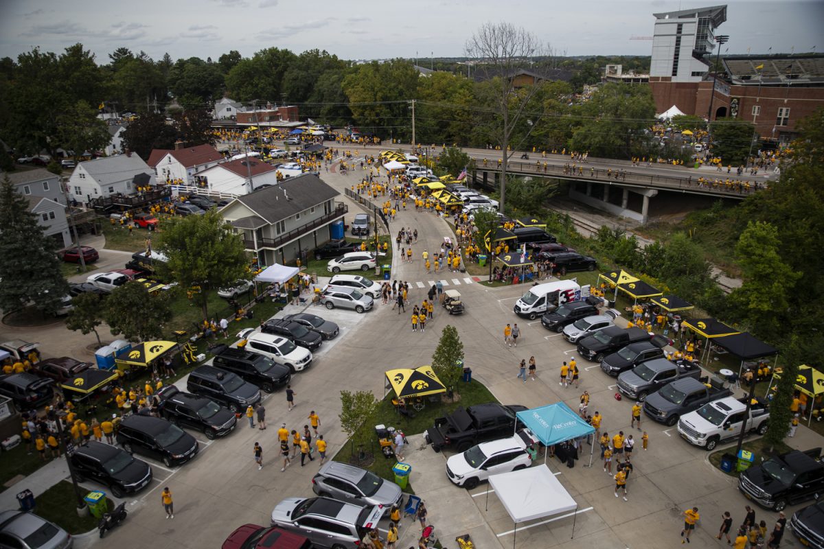 Fans walk along and near Melrose Ave. before a football game between the Iowa Hawkeyes and the Troy Trojans at Kinnick Stadium on Saturday, Sept. 14, 2024. Kickoff was at 3 p.m.