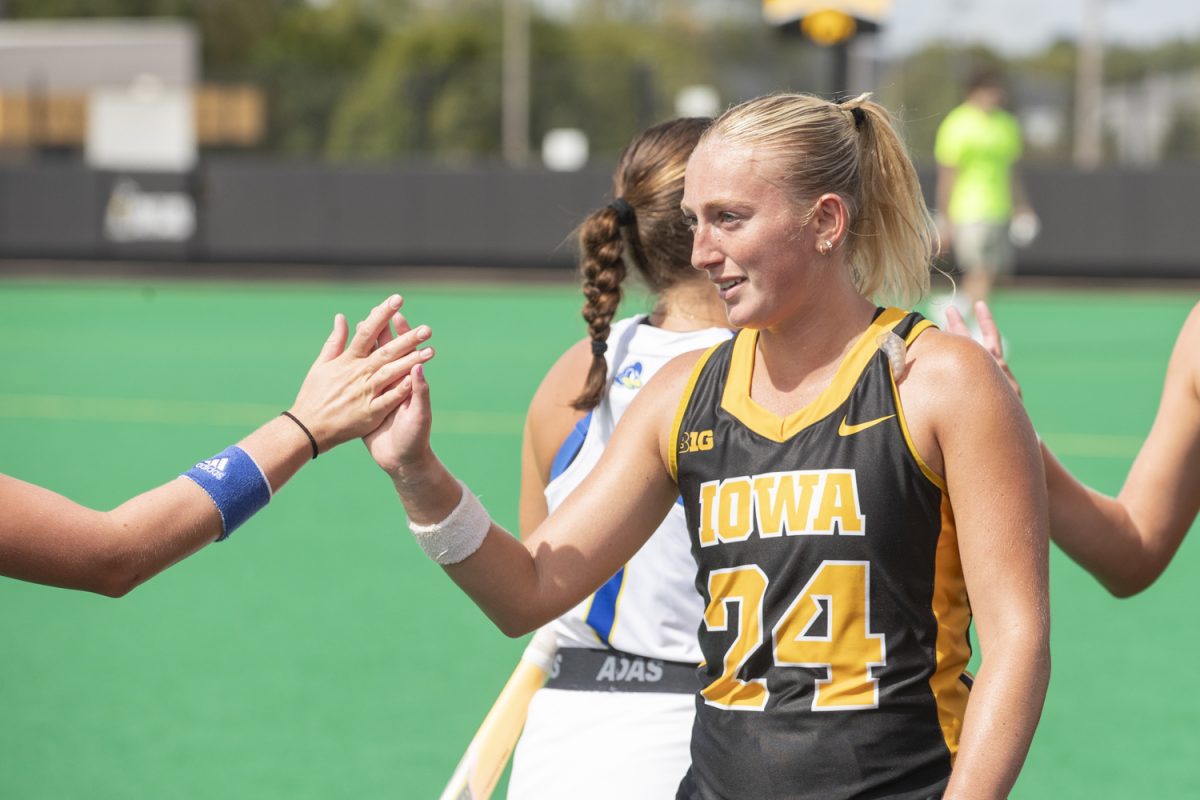 Iowa forward Annika Herbine shakes hands with Delaware players after a field hockey match between Iowa and Delaware at Grant Field on Sept. 15, 2024. The Hawkeyes defeated the Blue Hens, 1-0. 