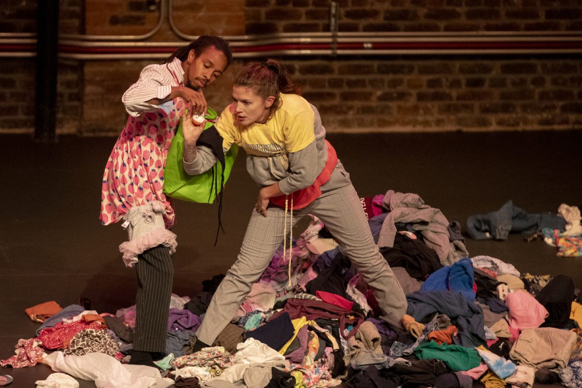 Joshua and Emily Culbreath of Snack Break Movement Arts perform “HAUL” during the Prompt for the Planet event at Englert Theatre on Sunday, Sept. 15, 2024. The piece represented a view on fast fashion and specifically critiqued clothing retailer SHEIN.