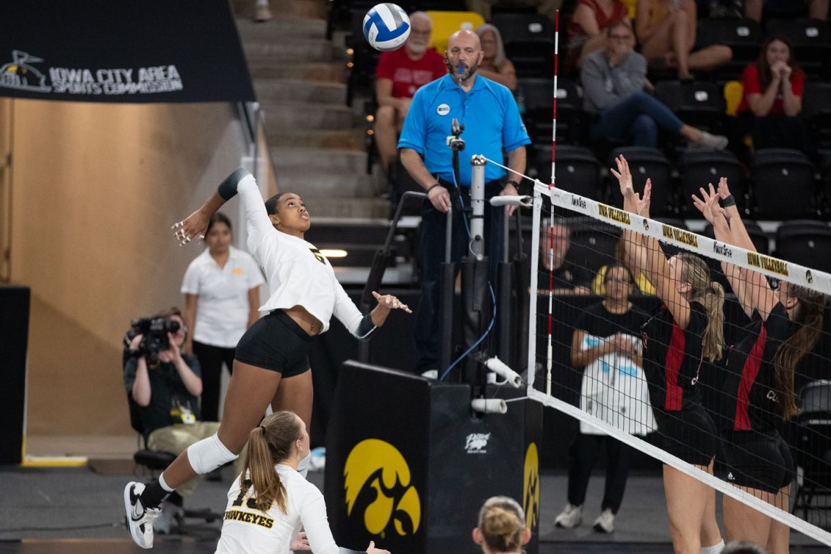 Dominique Phills hammers the ball towards opposing blockers during a volleyball match at Xtreme Arena in Coralville on Thursday Sept. 19, 2024. The Hawkeyes defeated the Coyotes 3-2. Phills scored 18 points against the Coyotes.