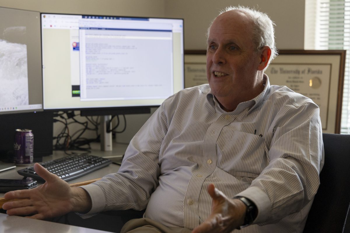 Professor Martin Grace speaks during an interview in his office in the Pappajohn Business Building in Iowa City on Thursday, Sept. 12. Grace is one of several "transformational hires" brought on by the University. He previously taught at Georgia State and Temple University.