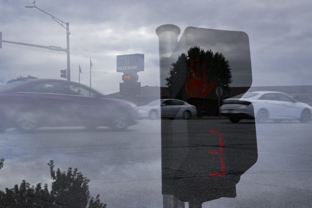 A double exposure photograph shows traffic on Highway 6 and a pedestrian traffic light on Monday, Sept. 23, 2024. 