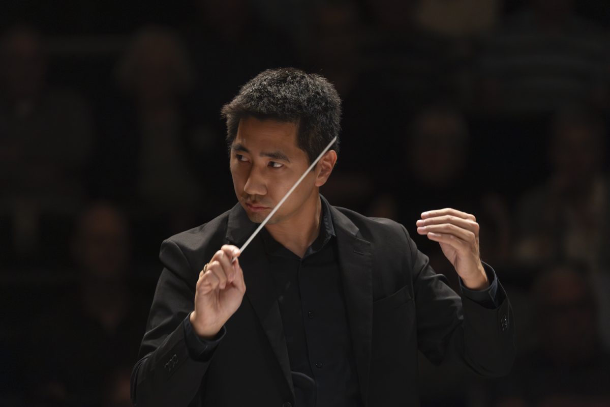 Conductor Kenny Lee leads the University of Iowa Symphony in their performance at the Voxman Music Building Concert Hall on Sept. 25, 2024. Lee also conducts the Chicago Youth Symphony Orchestra’s Philharmonic Orchestra.