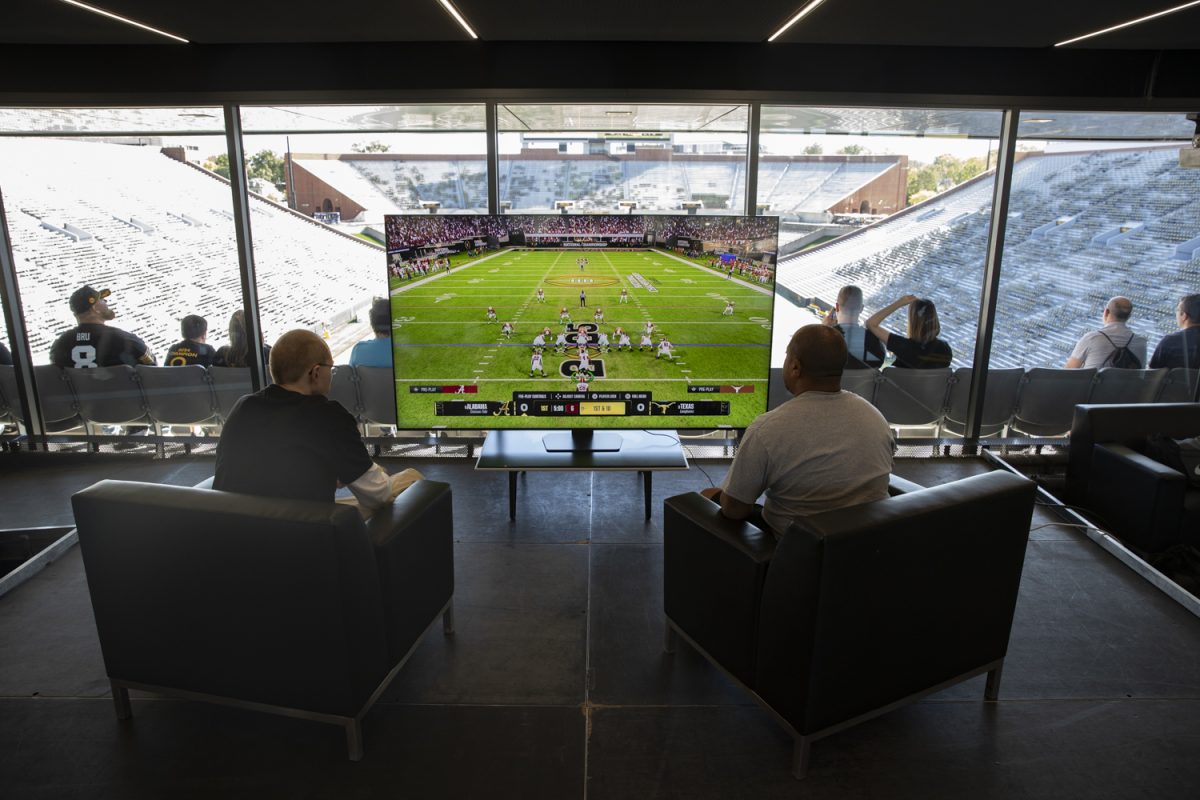 Tournament finalists Brandon Capper and Herve Cantrell face off in the final round of the University of Iowa Extra Life Charity Challenge: College Football 25 tournament held in the Kinnick Stadium Ted Pacha Family Club on Sept. 28. Each of the two made it through five rounds of competition to make it to the final matchup.