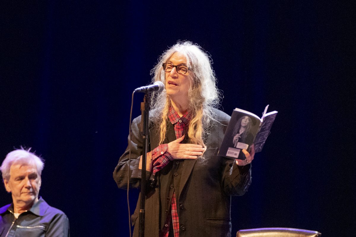 Patti Smith reads from her poetry during a reading and performance at the Englert Theatre during the Infinite Dream Festival on Friday, Sept. 27, 2024. Smith is an author, singer-songwriter, and activist who sang with her band, played guitar, and read from her award-winning writing during her two shows.