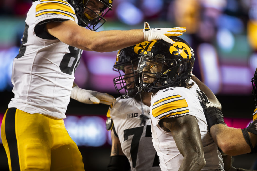 Iowa players celebrate a touchdown by Iowa running back Kaleb Johnson during a football game between Iowa and Minnesota at Huntington Bank Stadium in Minneapolis, MN on Saturday, Sept. 21, 2024. The Hawkeyes defeated the Golden Gophers 31-14, taking back the Floyd of Rosedale Trophy.