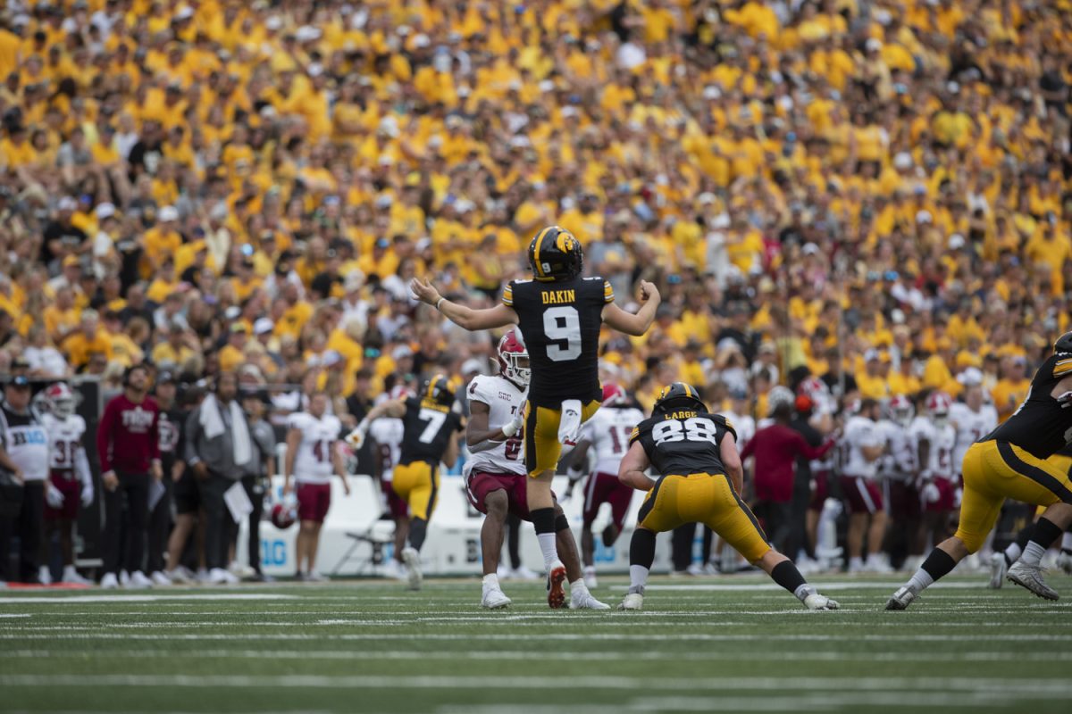 Iowa punter Rhys Dakin punts the ball during a football game between Iowa and Troy at Kinnick Stadium in Iowa City on Sept. 14, 2024. Dakin punted four times and averaged 49.3 yards. 