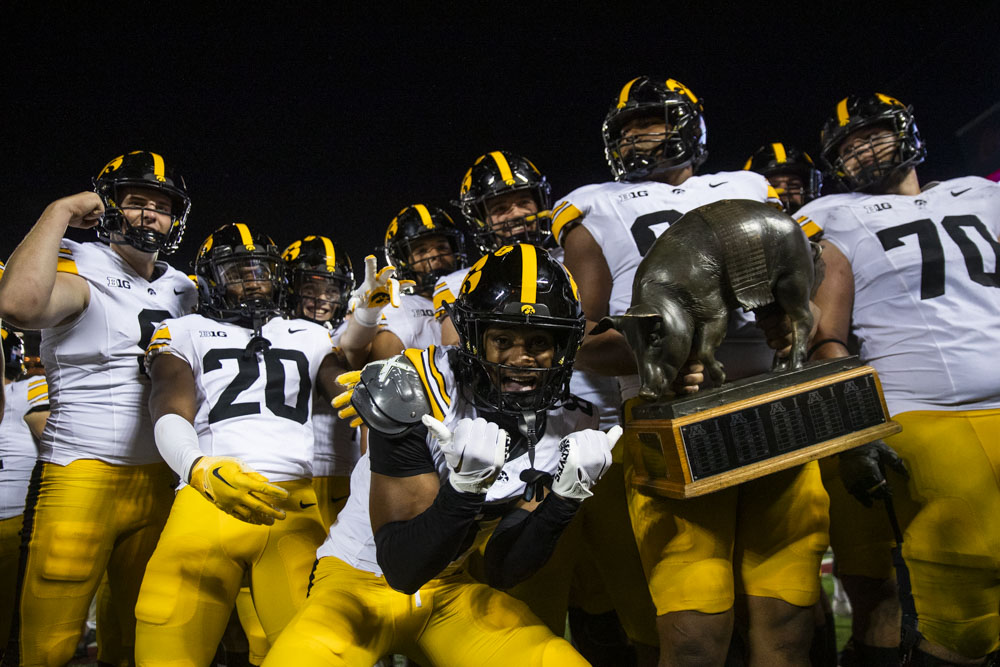 Iowa players celebrate after winning the battle for the Floyd of Rosedale trophy during a football game between Iowa and Minnesota at Huntington Bank Stadium in Minneapolis, MN on Saturday, Sept. 21, 2024. The Hawkeyes defeated the Golden Gophers 31-14.