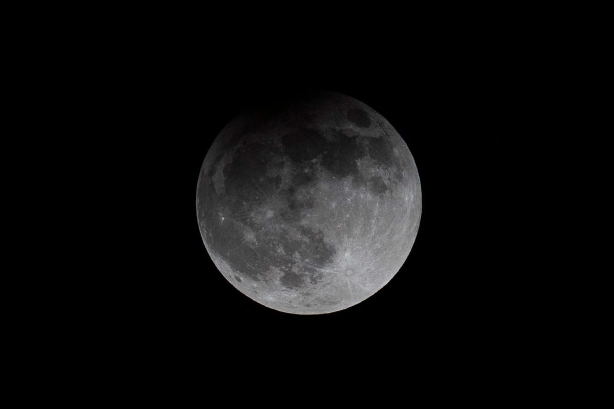 A Harvest Moon, which also happens to be an exceptionally bright and large supermoon, is seen during a partial lunar eclipse as it begins to recede at about 11 p.m., Tuesday, Sept. 17, 2024, in Indian River County, Florida. A mini moon will soon join the moon's orbit. 