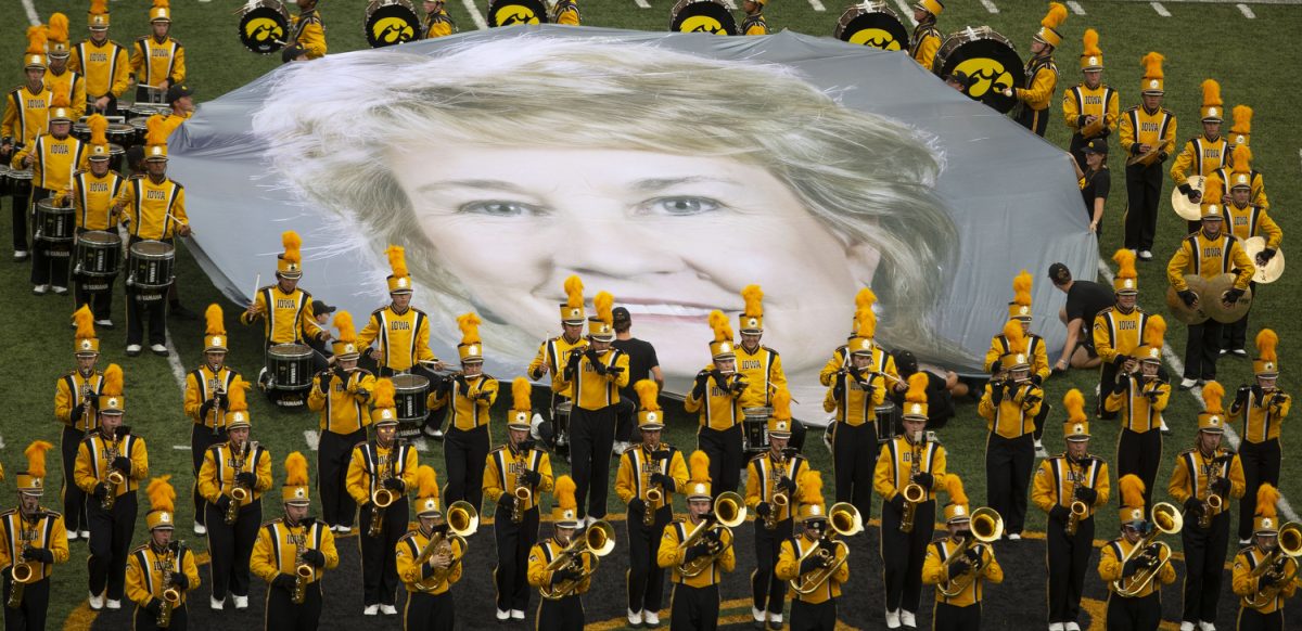 Iowa Marching Band holds up a banner of Lisa Bluder during halftime at a football game between Iowa and Troy at Kinnick Stadium on Saturday, Sept. 14, 2024. The Hawkeyes defeated the Trojans, 38-21. 