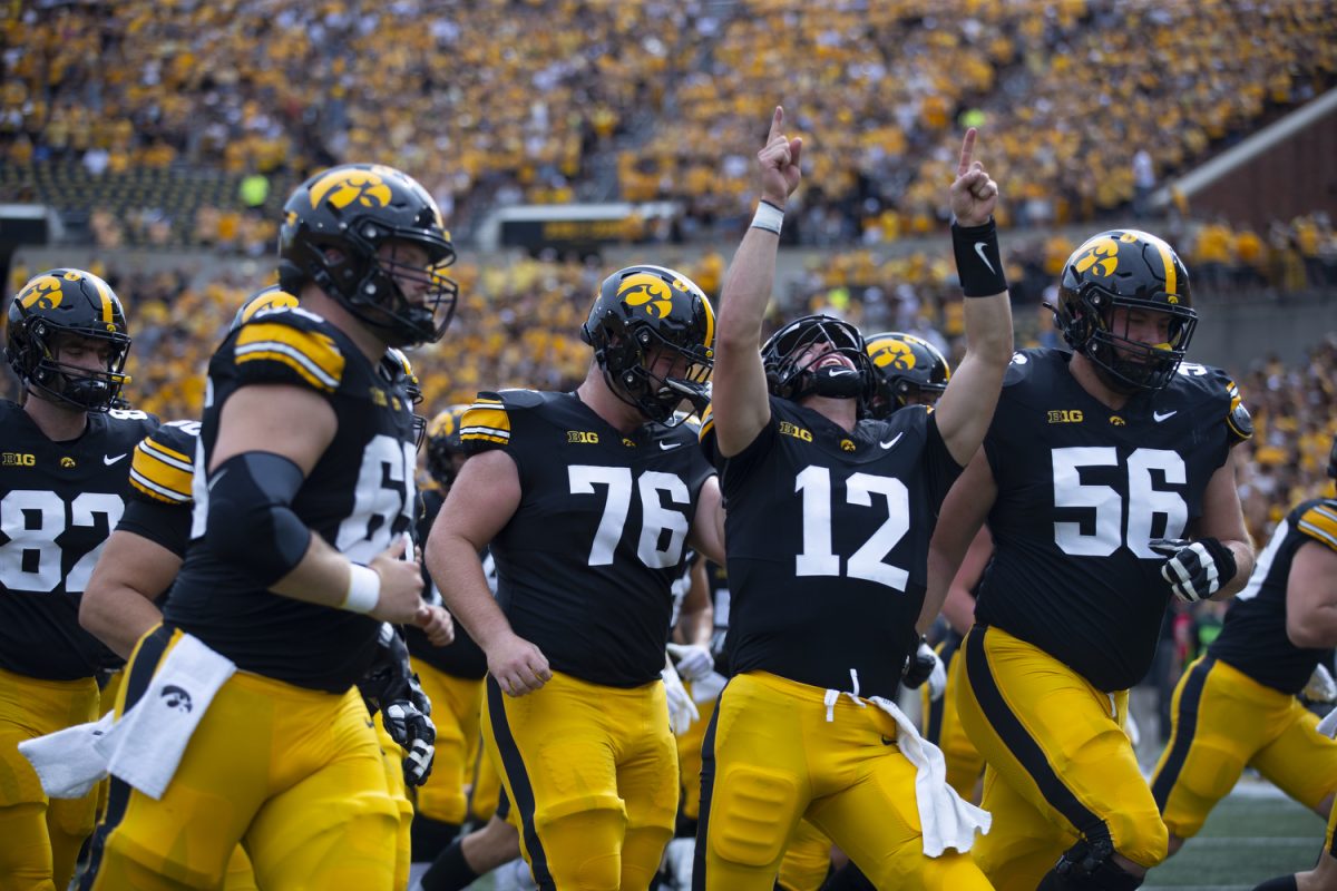 Iowa quarterback Cade McNamara cheers before a football game between Iowa and Troy at Kinnick Stadium on Saturday, Sept. 14, 2024. The Hawkeyes defeated the Trojans, 38-21. 