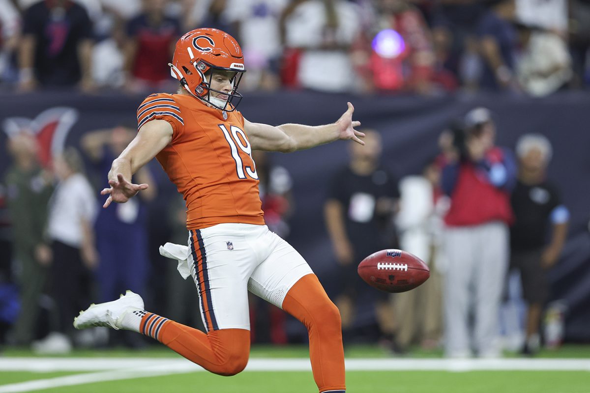 Sep 15, 2024; Houston, Texas, USA; Chicago Bears punter Tory Taylor (19) punts the ball during the game against the Houston Texans at NRG Stadium. 