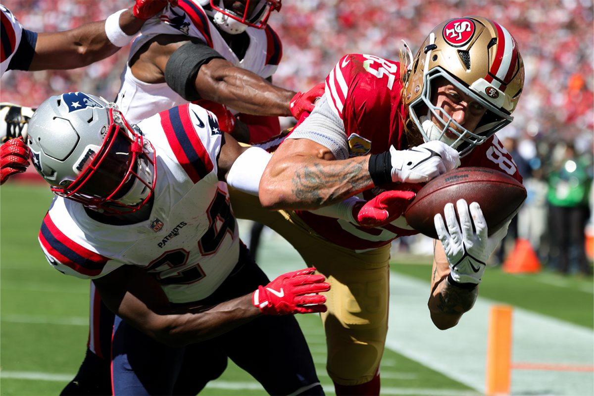 Sep 29, 2024; Santa Clara, California, USA; San Francisco 49ers tight end George Kittle (85) catches a touchdown against New England Patriots safety Dell Pettus (24) during the second quarter at Levi's Stadium. 