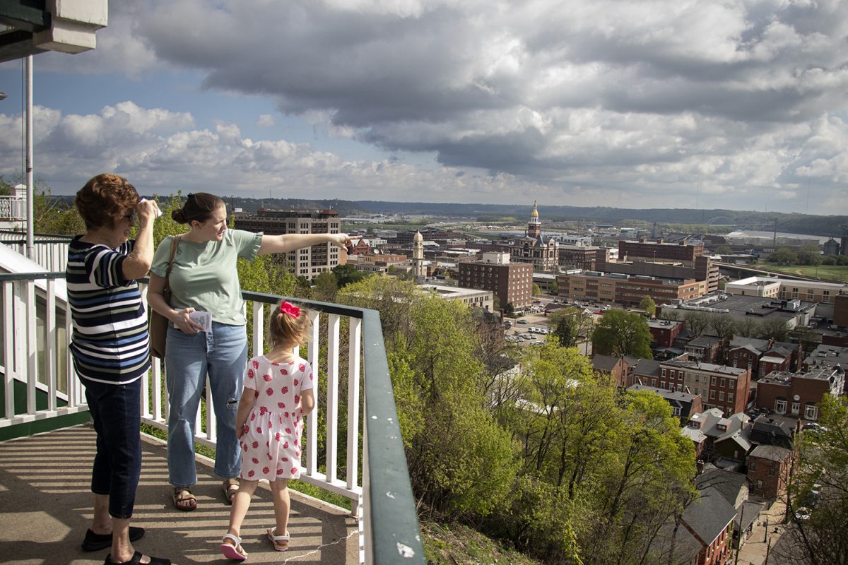 A family enjoys the view from the top deck of The Fenelon Place Elevator in Dubuque, Iowa, on Saturday, April 27, 2024. Senior Photojournalist Jordan Barry and other students participated in capstone journalism and mass communication courses that collaborated with Dubuque, Iowa, earlier in the year. This is one of Barry's photographs from the class that focused on sustainability efforts.