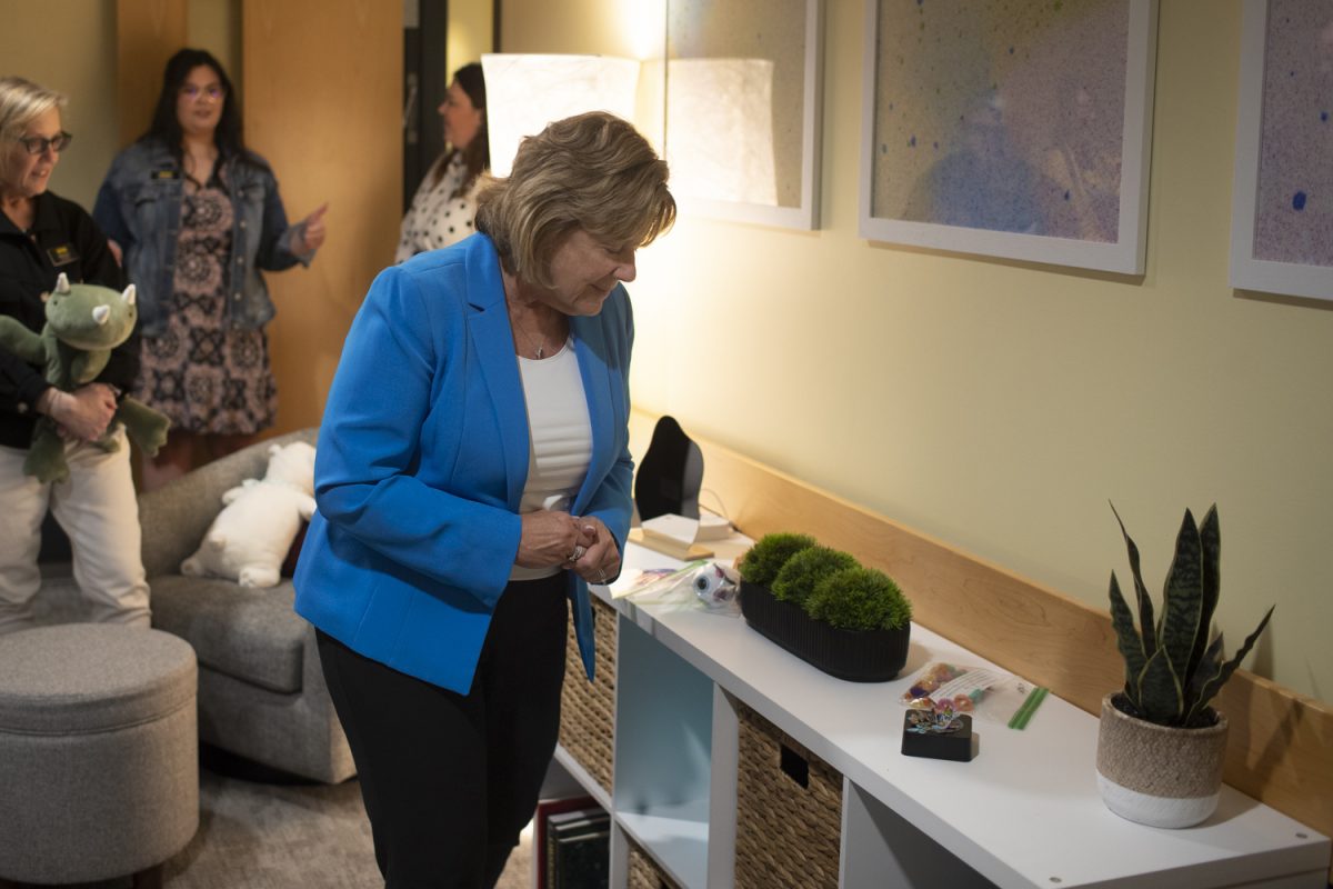 University of Iowa President Barbara Wilson looks at fidget toys that are available to students during the Student Disability Services Lounge Open House on Sept. 24, 2024. The lounge is in room 1101 of the University Capitol Center and is open to all students. It was created to provide an inclusive and low sensitivity environment for students on campus.