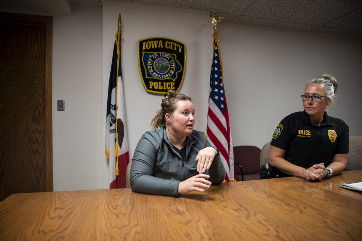 CommUnity Crisis Services Mental Health's Law Enforcement Liaison, Kelsie Tomlin (Left), and Iowa City Police Officer Kristie Davis (Right) answer questions in a conference room at the Iowa City Police Department on Sept. 30. ICPD has partnered with CommUnity since February 2021 to embed a mental health liaison within the department in order to enhance the services provided to those in the community experiencing a mental health crisis and connect them with the appropriate resources.