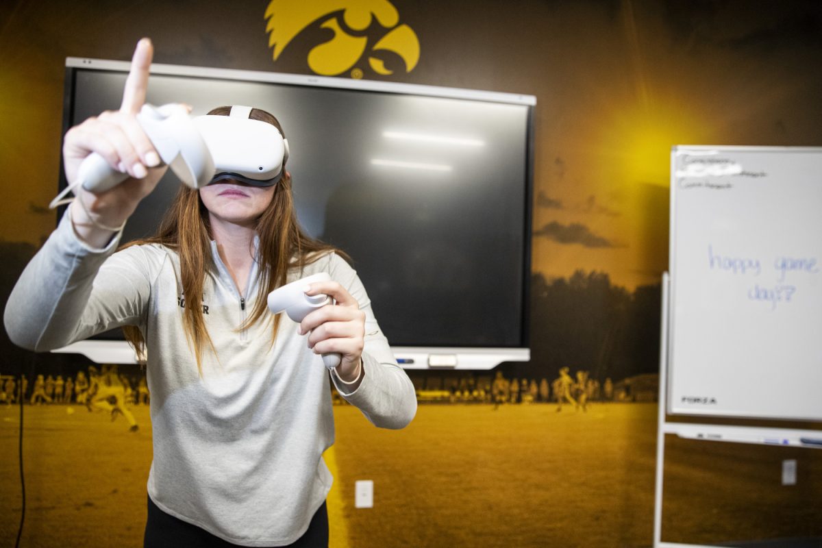 Iowa goalkeeper Taylor Kane uses a VR headset at the Iowa Soccer Complex in Iowa City on Sept. 30. The VR headsets are used to run through exercises that test the quickness of player reactions.