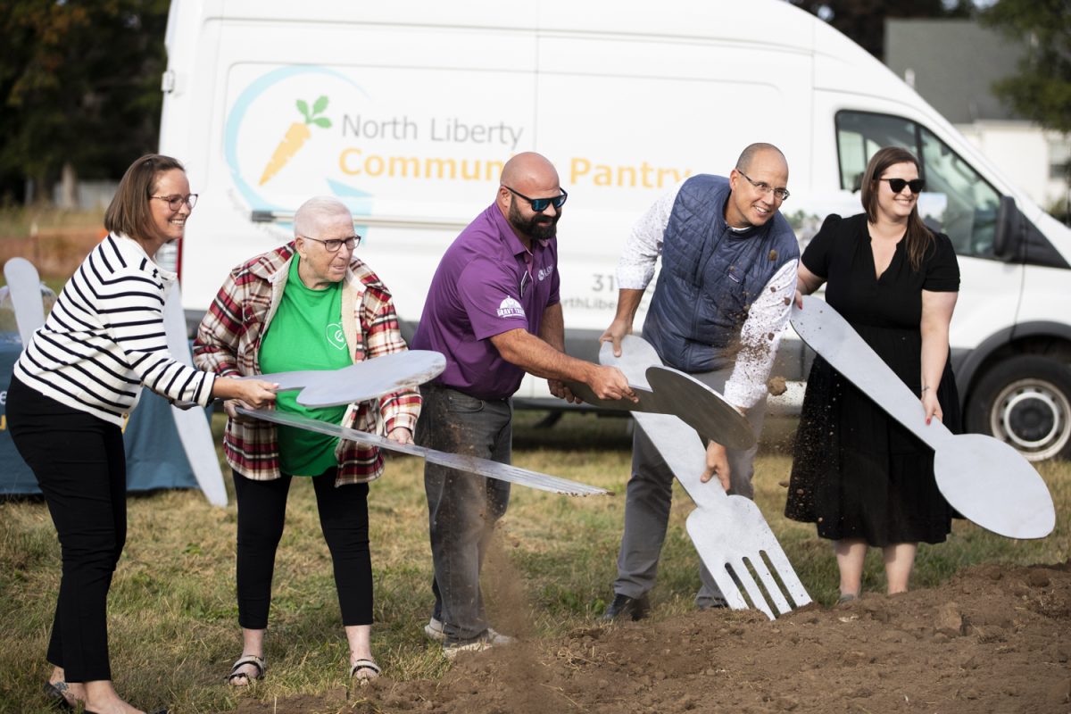 Capital Campaign committee members commence the start of the construction of a new building during the groundbreaking event for the organization on Oct. 1. Several groups had the opportunity to use giant forks, spoons, and knives to mark the occasion.