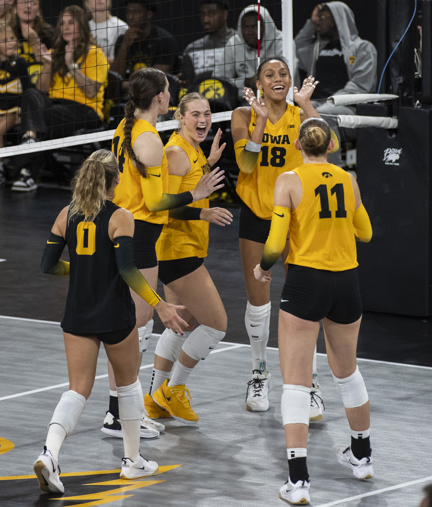 The Iowa women’s volleyball team celebrates after a kill during a volleyball game between No. 25 Washington and Iowa at Xtream Arena in Coralville on Saturday, Oct. 5, 2024. The Huskies defeated the Hawkeyes, 3-0.