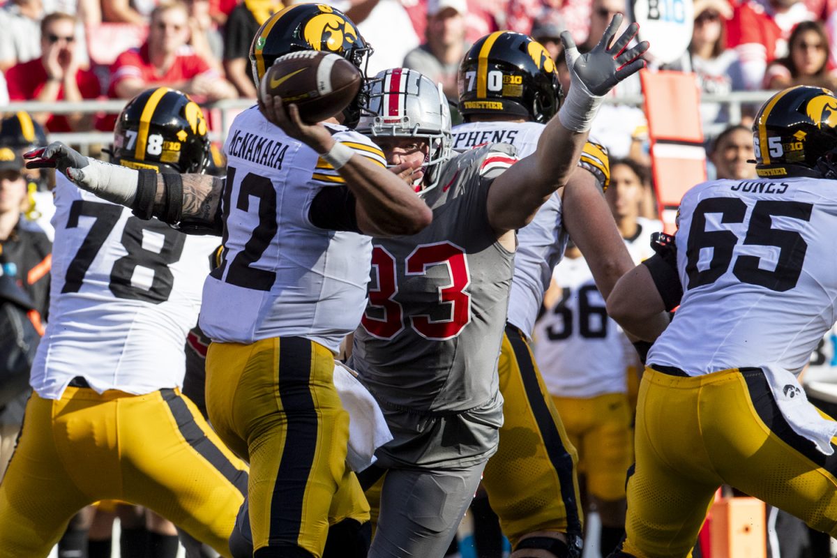 Ohio State defensive end Jack Sawyer tries to block Iowa quarterback Cade McNamara’s pass during a football game between No. 3 Ohio State and Iowa at Ohio stadium in Columbus on Saturday, Oct. 4, 2024. The Buckeyes lead the Hawkeyes, 7-0. (Cody Blissett/The Daily Iowan)