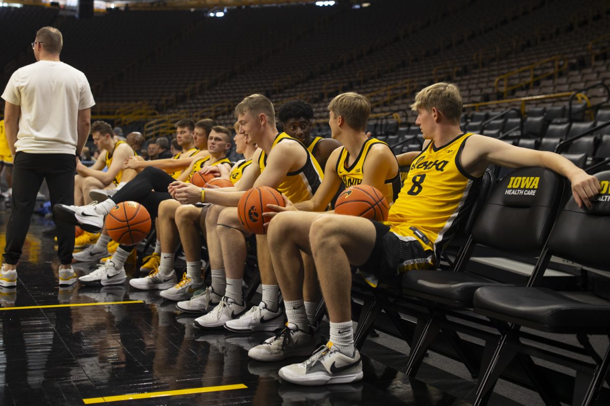 Iowa players sit on the bench during the mens basketball media day at Carver-Hawkeye Arena in Iowa City on Monday, Oct. 7, 2024. The team took interviews from the media and held an open practice.